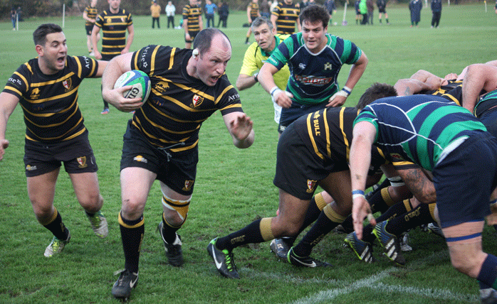 Simon Brading peels away from the ruck and heads for the line